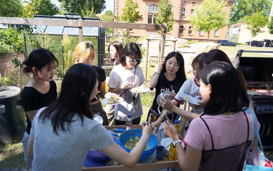 students chatting at the barbecue