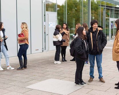 students in front of a building